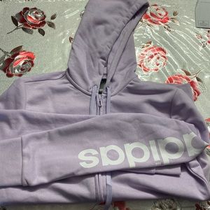 Light purple adidas zip up with a hood